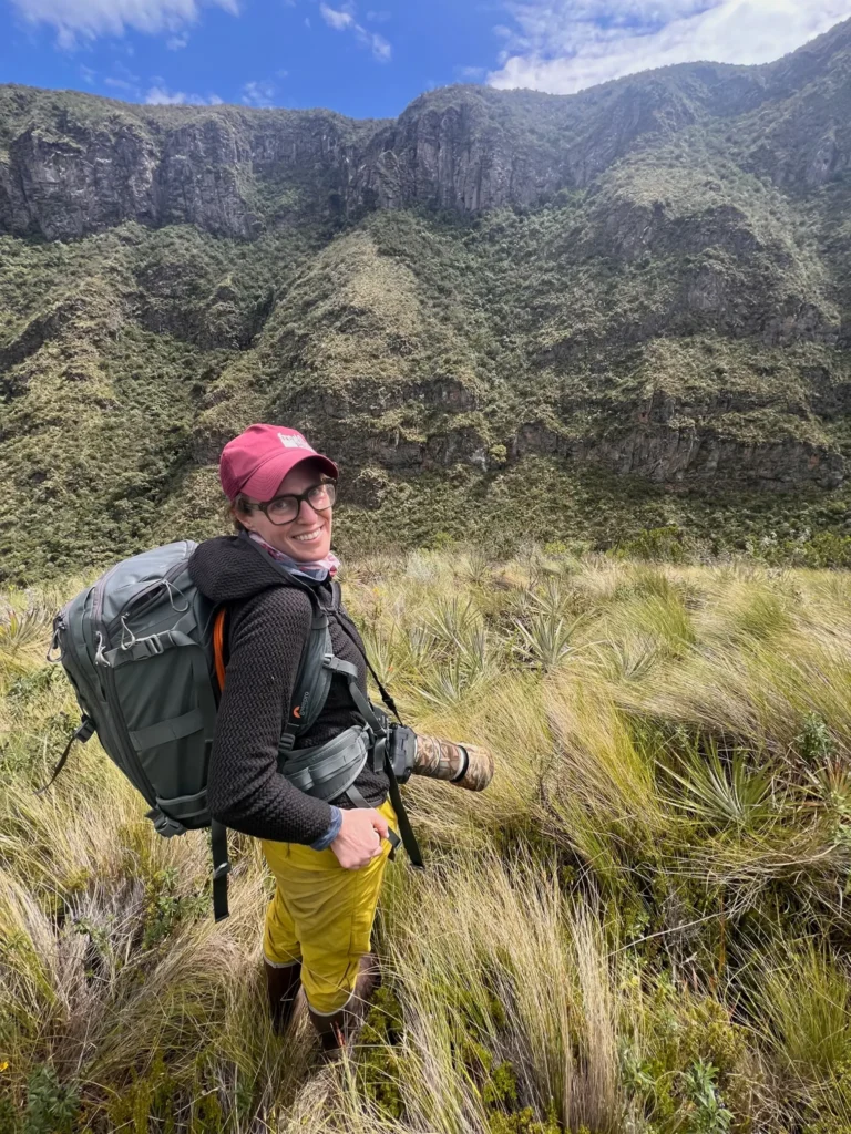 Laurie with camera in Andes Mountains in Ecuador, South America